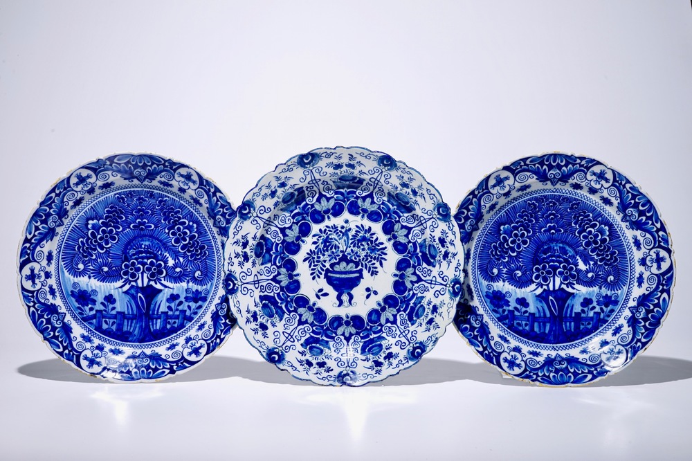 A pair of Dutch Delft blue and white "Tea Tree" dishes and a dish with a flower basket, 18th C.