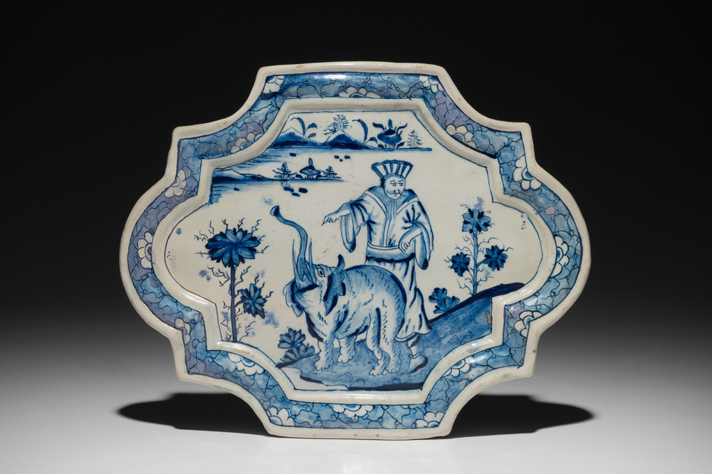 A Dutch Delft blue and white chinoiserie plaque with an elephant, 18th C.