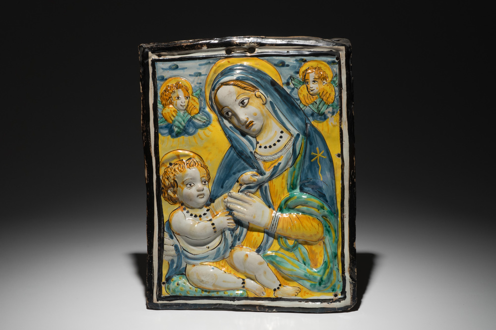 A rectangular relief-decorated Italian maiolica plaque with Virgin and child, Deruta, 17th C.