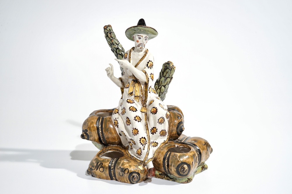A French faience ink stand modelled as a seated Chinese, Lille, 18th C.