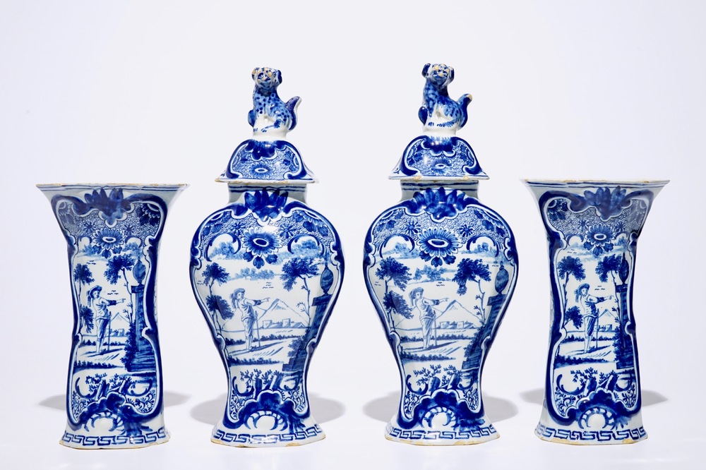 A fine Dutch Delft blue and white four-piece garniture with a farmer, 2nd half 18th C.