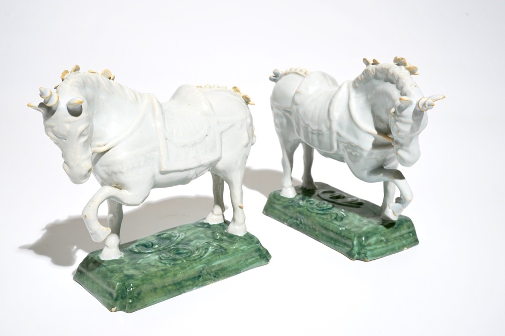 A pair of white Dutch Delft circus horses on a green base, 18th C.