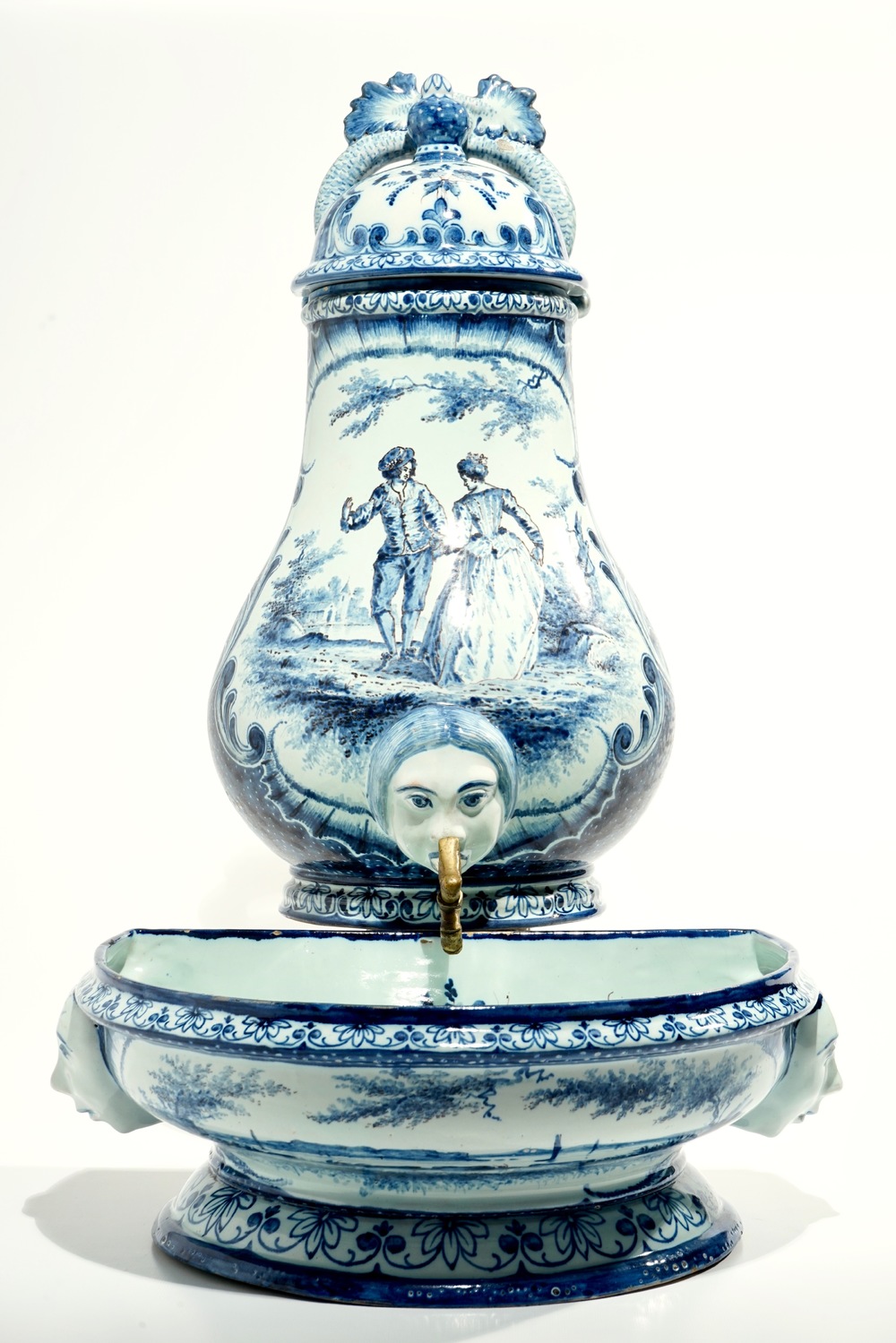 A blue and white French faience Delft style wall fountain and basin, Bourg-la-Reine, dated 1890