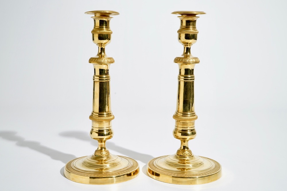 A pair of gilt bronze Empire candlesticks, France, 19th C.