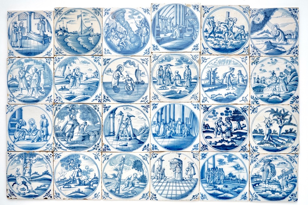 Een veld van 24 blauwwitte Delftse tegels met bijbels decor in medaillon, 18e eeuw