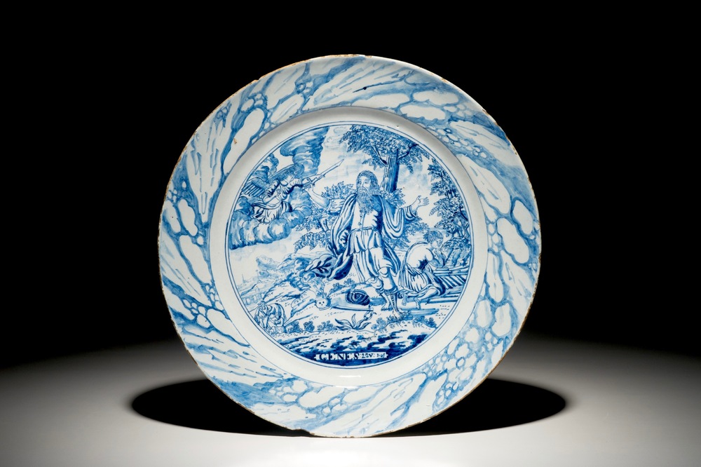 A Dutch Delft style blue and white biblical "Sacrifice of Isaac" dish, Amsterdam, 1st half 18th C.