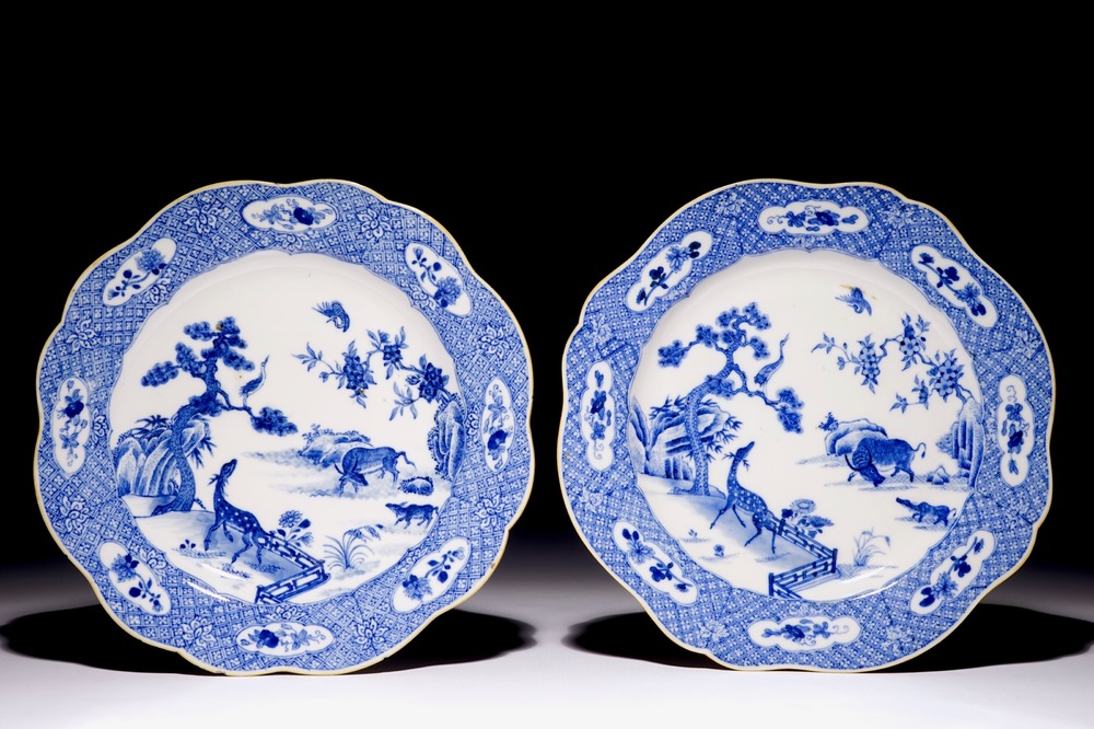 A pair of Chinese blue and white plates with animals in a garden, Qianlong