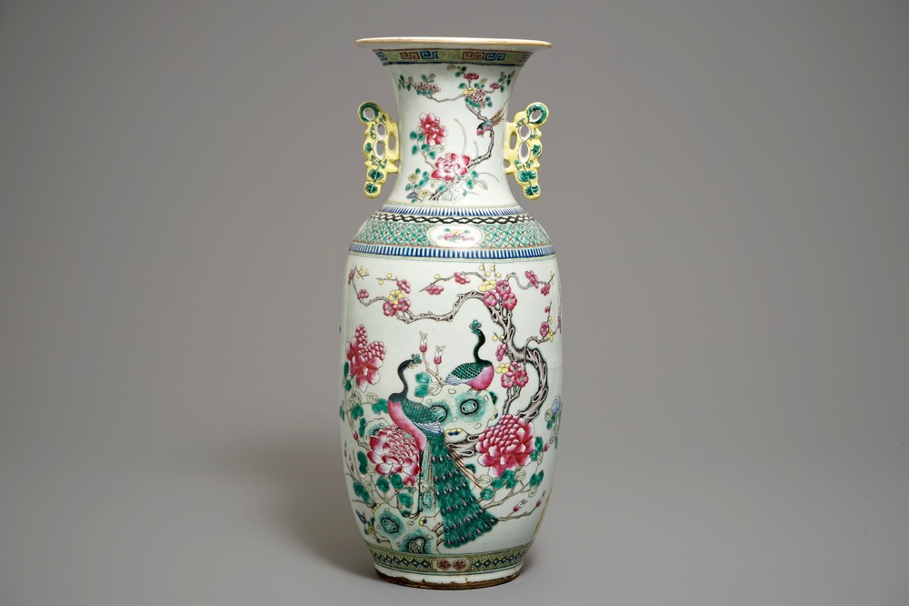 A large Chinese famille rose vase with peacocks and antiquities, 19th C.