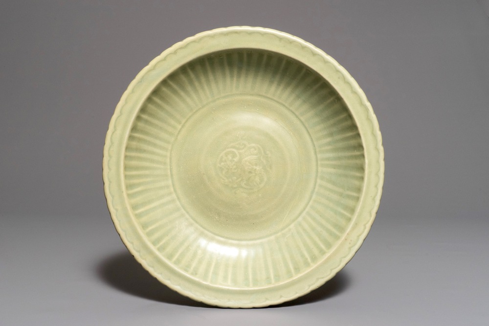 A Chinese Longquan celadon charger with underglaze dragon, Ming