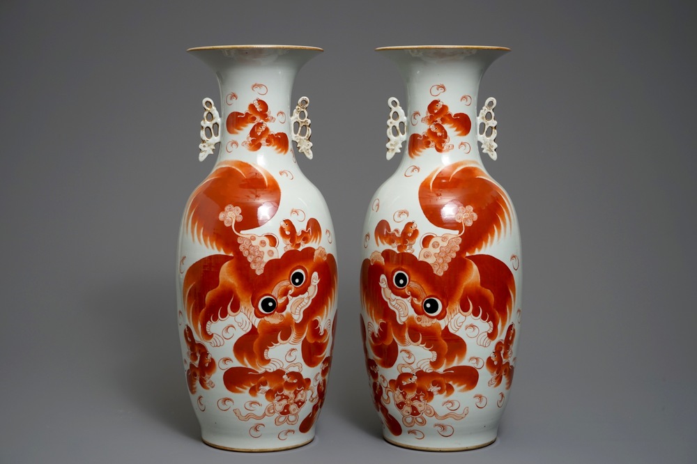 A pair of large Chinese iron red vases with Buddhist lions, 19/20th C.