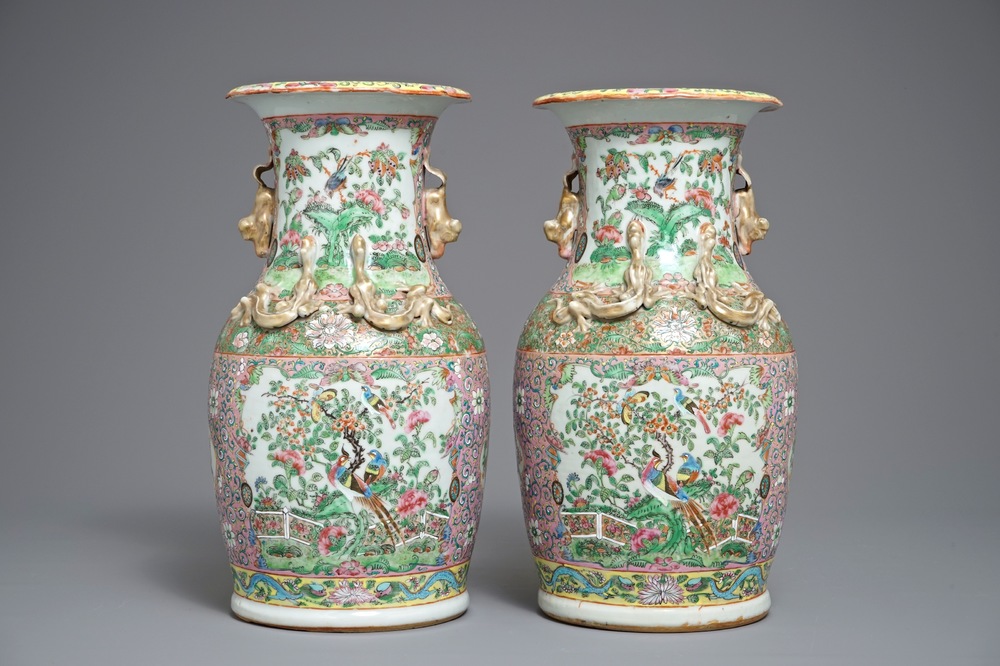 A pair of Chinese pink ground Canton vases, 19th C.