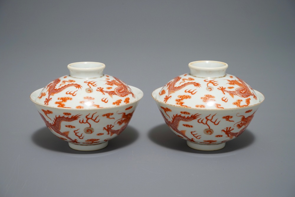A pair of Chinese iron red dragon bowls and covers, Xianfeng mark, 19/20th C.