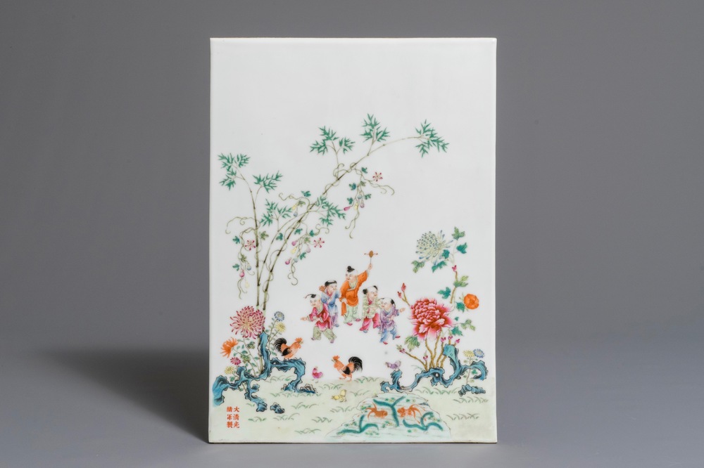 A Chinese famille rose plaque with boys in a landscape, Guangxu mark, Republic, 1st half 20th C.