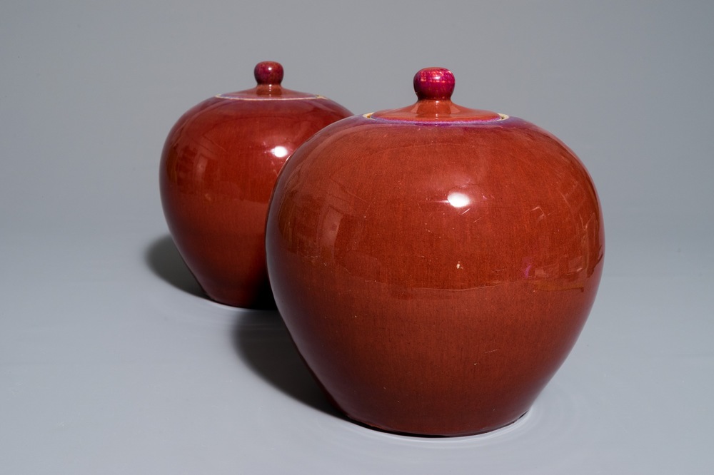 A pair of Chinese monochrome oxblood-glazed ginger jars and covers, 19th C.