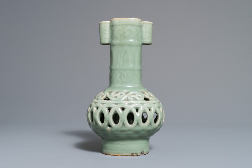 A Chinese celadon-glazed reticulated double-walled vase, 19/20th C.