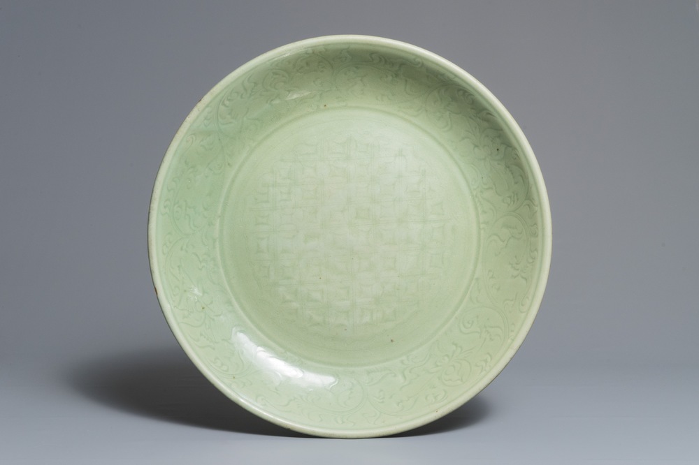 A massive Chinese Longquan celadon dish with underglaze design, Ming