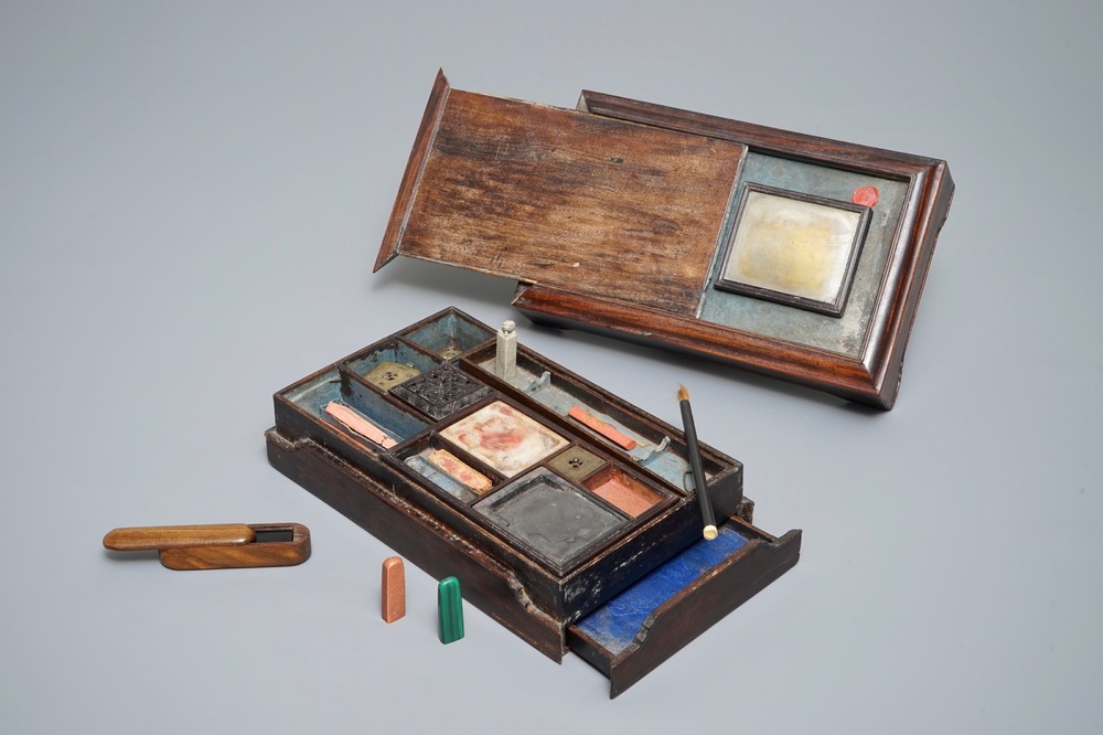 A Chinese calligraphy or artist's set in wooden box containing various seals, an ink stone and more, 19/20th C.