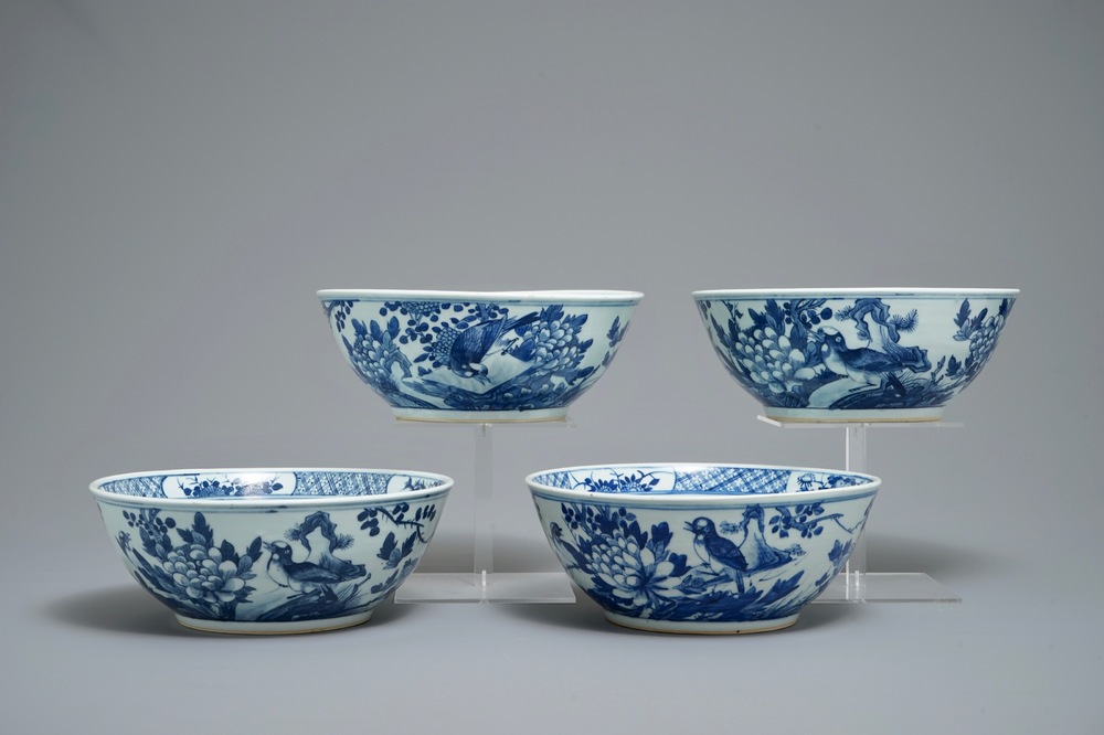 Four Chinese blue and white bowls with birds, butterflies and flowers, 19th C.