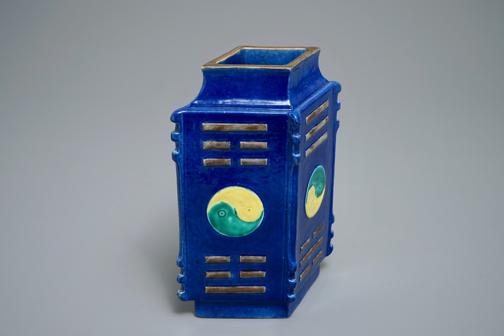 A Chinese blue-ground lozenge-shaped cong vase with taoist symbols, 19th C.