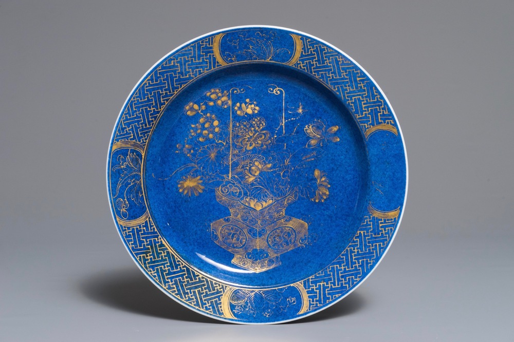 A Chinese powder blue and gilt dish with a flowervase, Kangxi