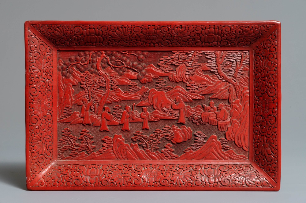 A rectangular Chinese cinnabar lacquer tray with figures in a landscape, 18/19th C.