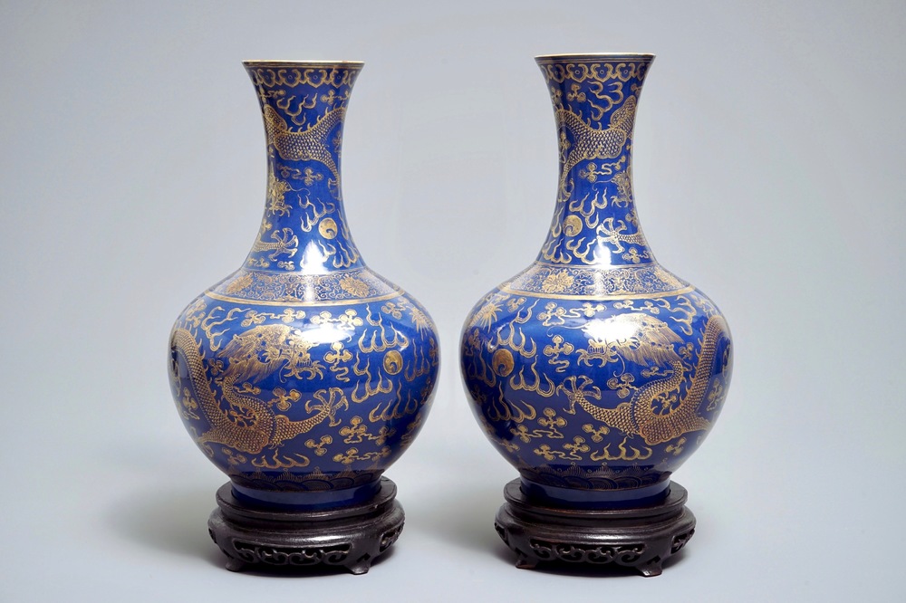 A pair of Chinese monochrome blue vases with gilt dragon design, 19th C.