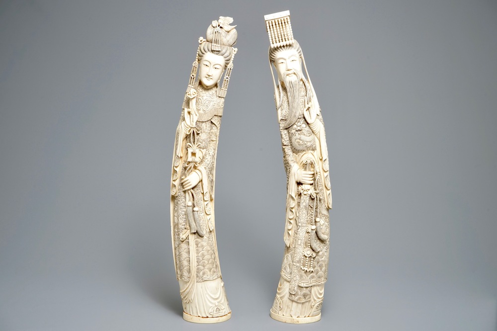A pair of large Chinese ivory figures of an emperor and his wife, 19th C.