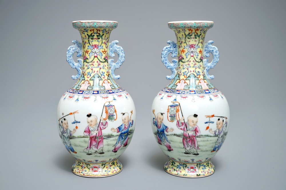 A pair of Chinese famille rose vases with playing boys, Qianlong mark, Republic, 20th C.