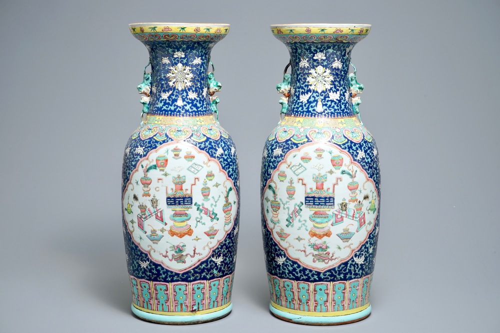 A pair of Chinese famille rose blue-ground vases, 19th C.