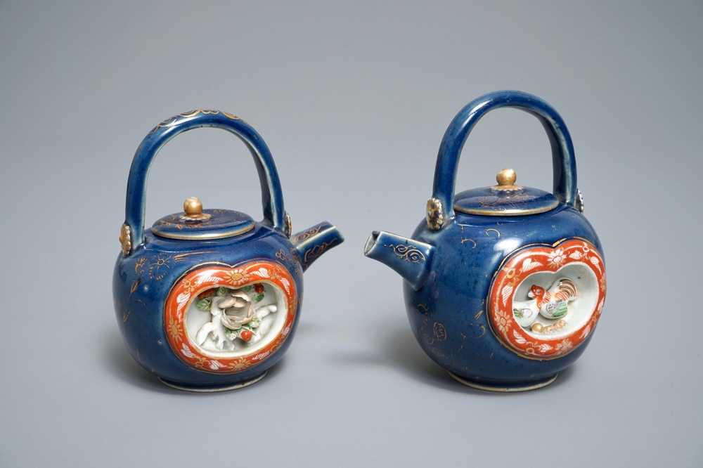 Two Japanese blue-ground Imari teapots with moulded designs of roosters and flowers, Edo, 17/18th C.