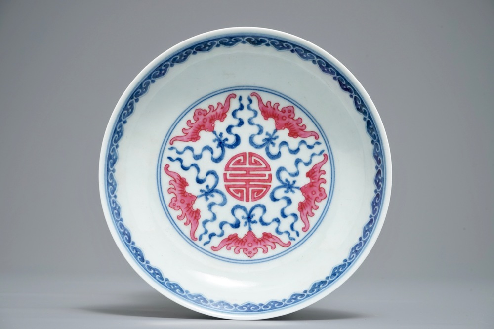A Chinese puce-enamelled 'Bats and shou' plate, Qianlong mark, 20th C.