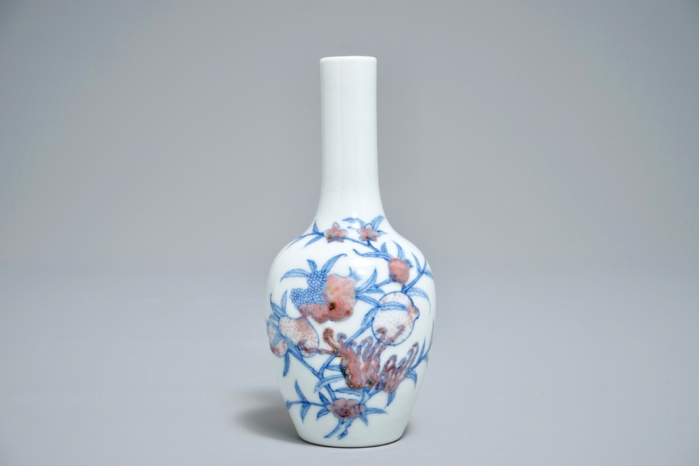 A Chinese blue and underglaze red 'sanduo' vase, Kangxi mark, 19/20th C.