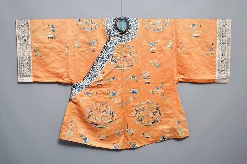 A Chinese orange-ground embroidered silk robe, 19th C.