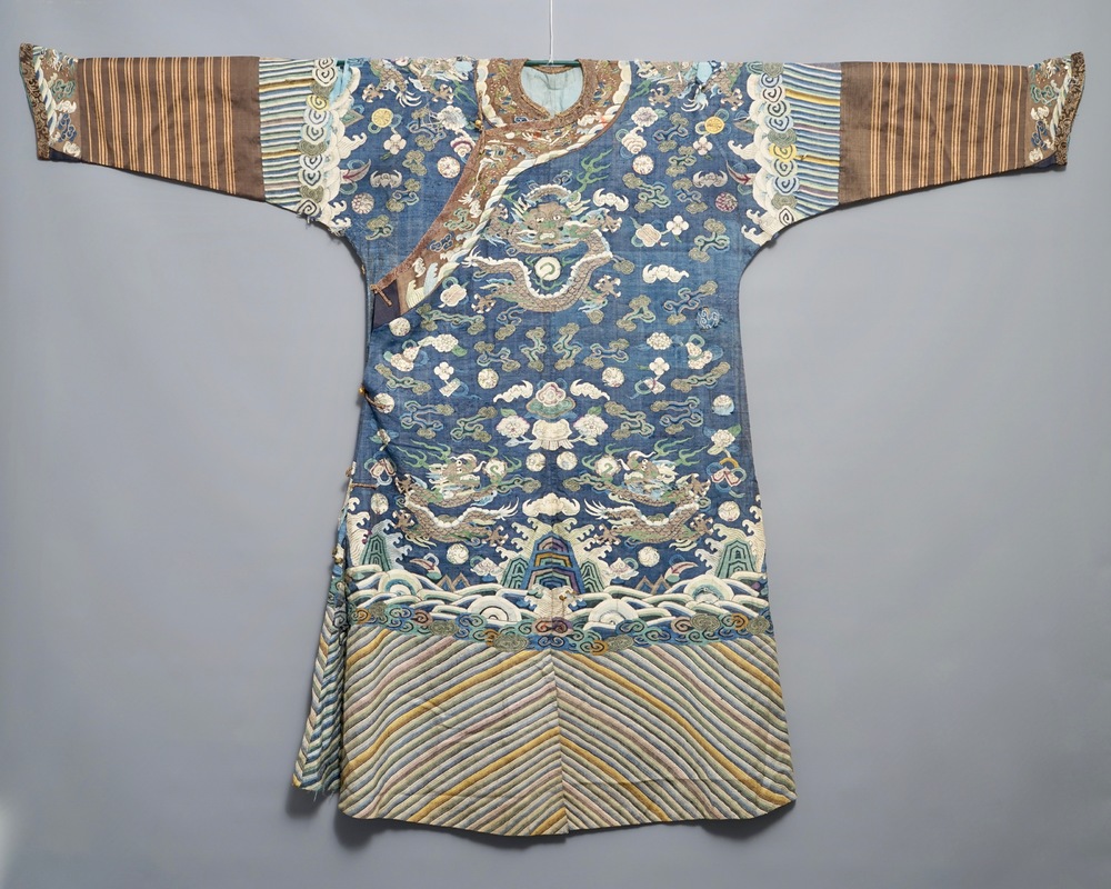 A Chinese blue-ground kesi eight-dragon robe, 19th C.