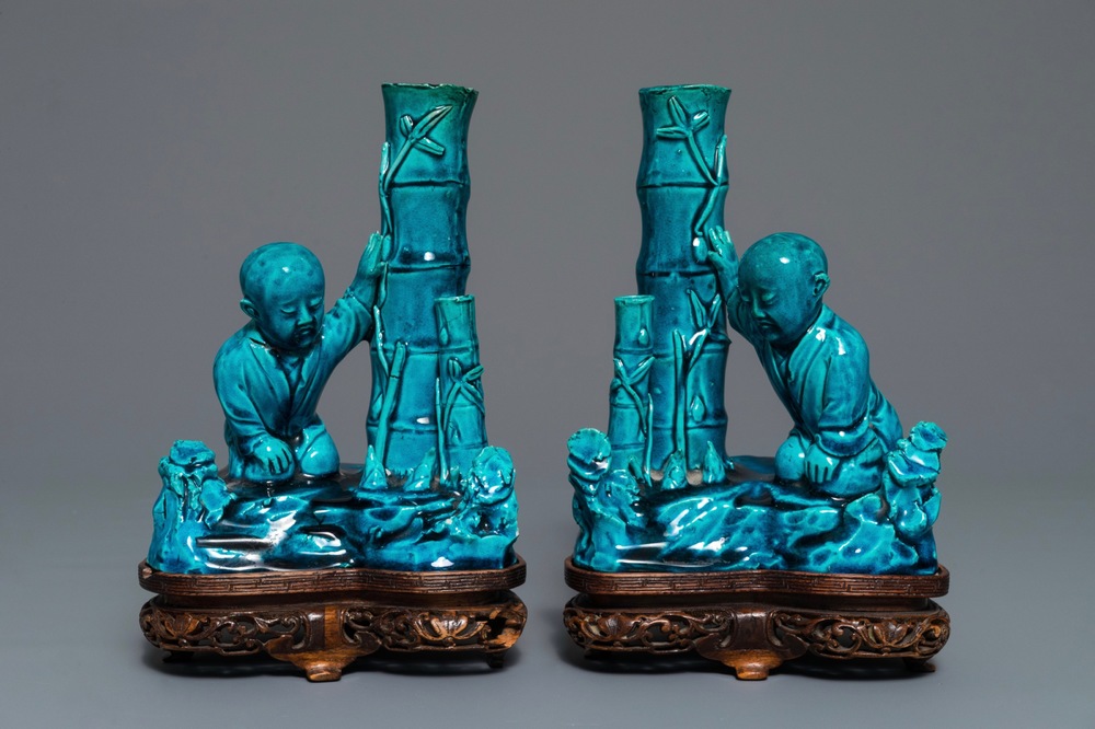 A pair of Chinese turquoise glazed incense holders on wooden stand, 19th C.