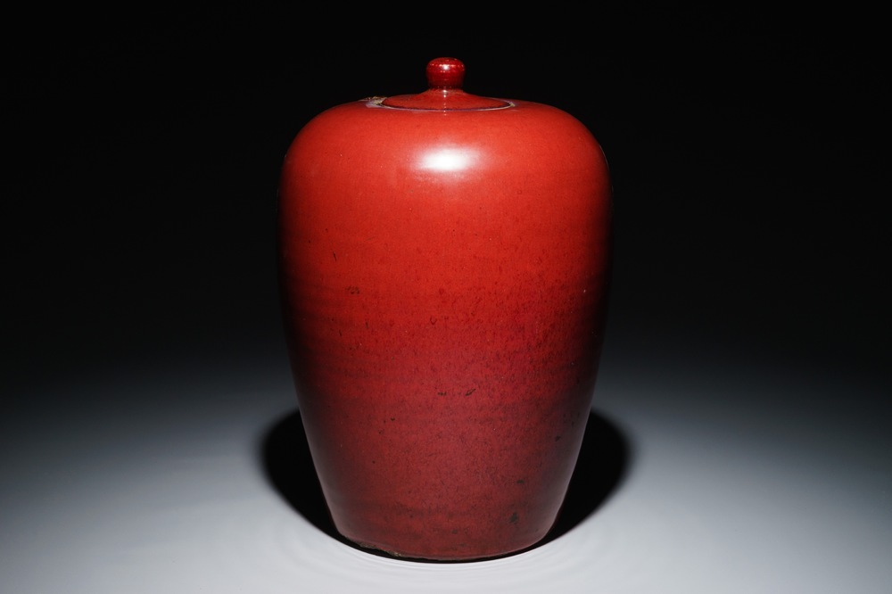 A Chinese monochrome oxblood-glazed jar and cover, 19th C.