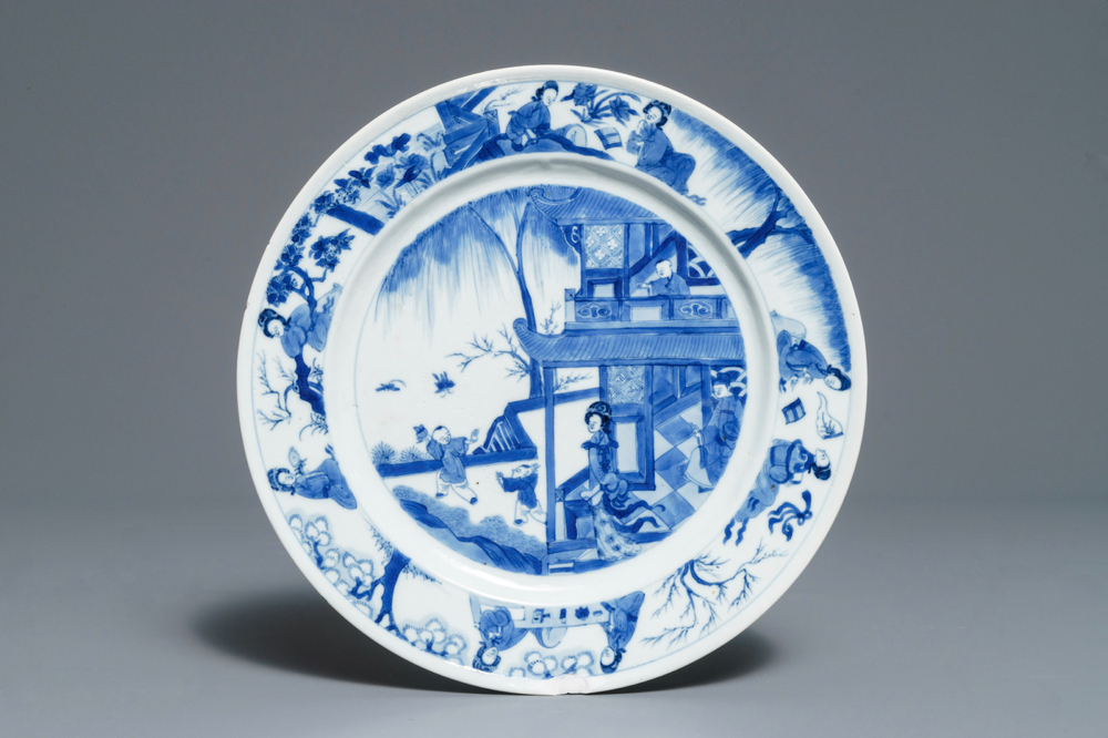 A Chinese blue and white plate with figures in a pagoda, Kangxi