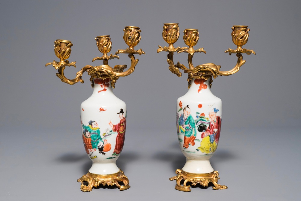 Une paire de vases en porcelaine de Chine famille rose mont&eacute;s comme candelabres, Yongzheng