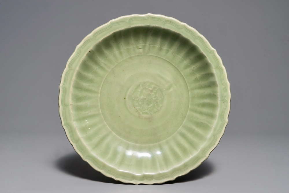 A Chinese Longquan celadon dish with underglaze design, Ming
