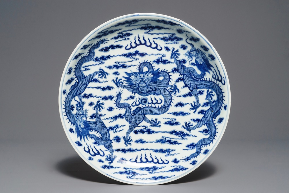 A Chinese blue and white 'dragon' dish, Kangxi mark, 19th C.
