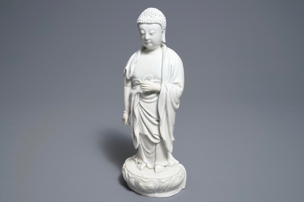 A Chinese Dehua blanc de Chine model of a standing Buddha, impressed mark on the back, Kangxi