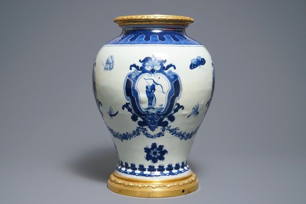 A Chinese blue and white ormolu-mounted 'The Archer' cistern after Cornelis Pronk, Qianlong, ca. 1740