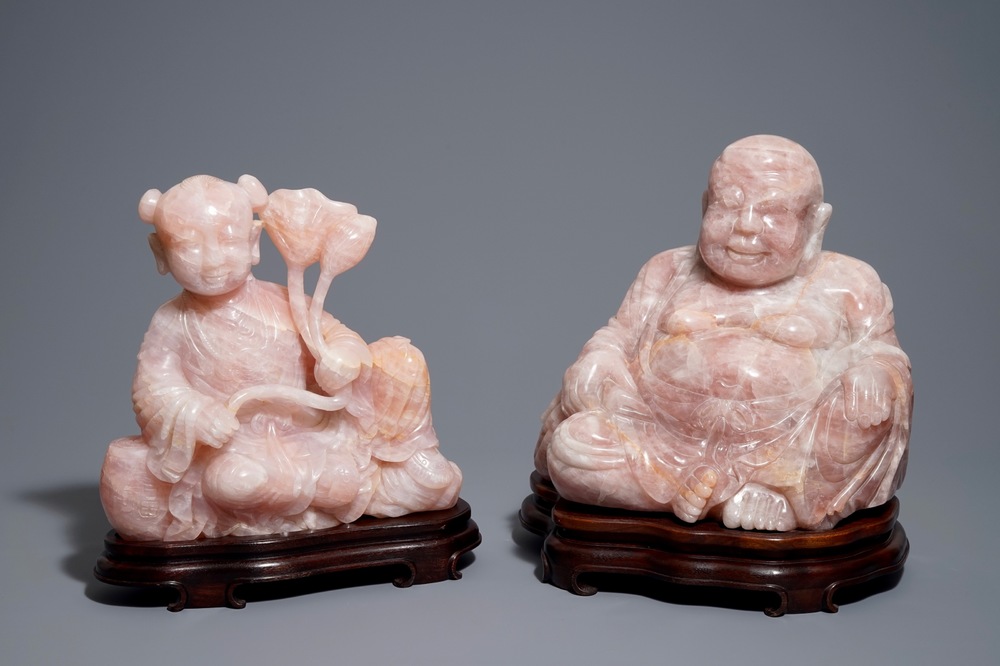 Two large Chinese pink quartz figures on wooden stands, 20th C.
