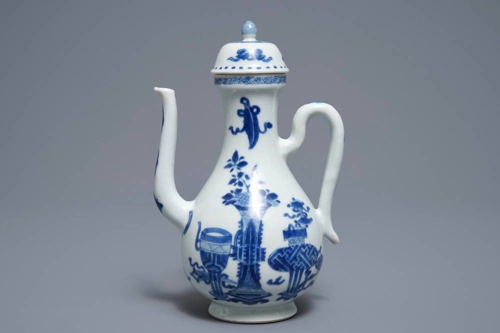 A Chinese blue and white ewer and cover with 'antiquities' design, Kangxi