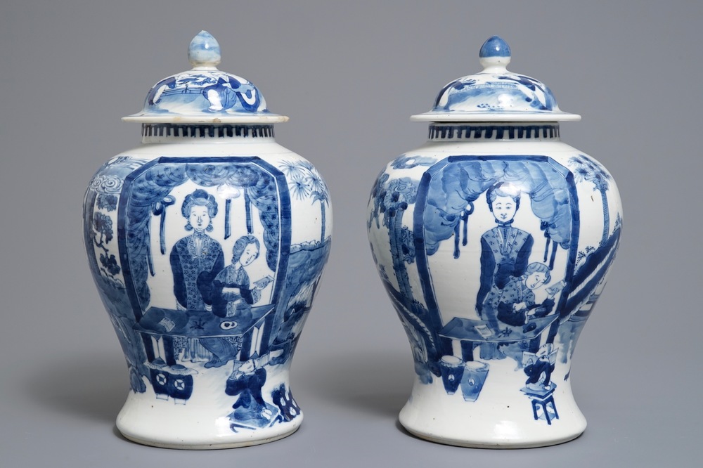 A pair of Chinese blue and white vases and covers, Kangxi mark, 19th C.