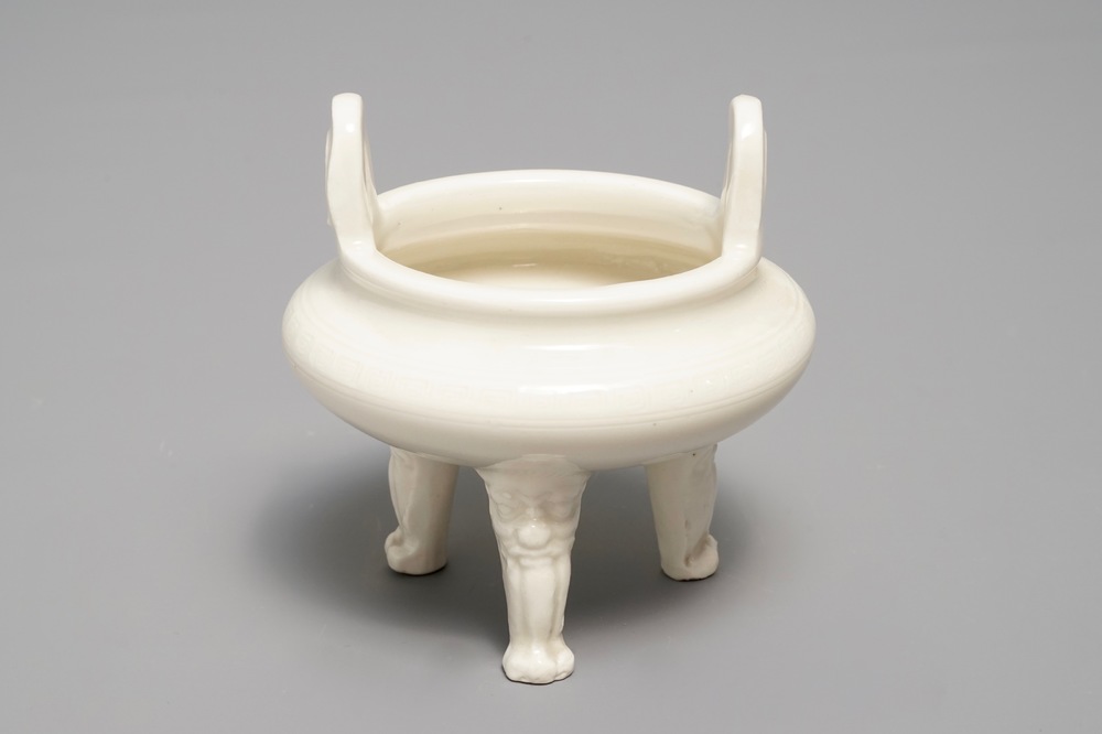 A Chinese Dehua blanc de Chine tripod censer, impressed seal mark, Kangxi