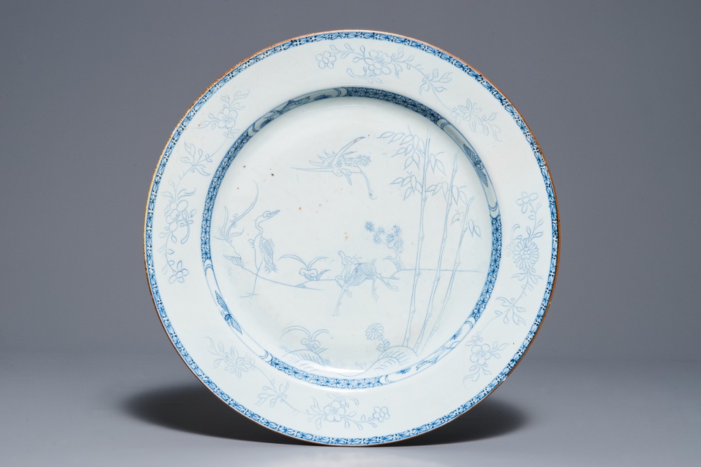 A Chinese blue and white pencil style charger with a deer and two herons, Yongzheng