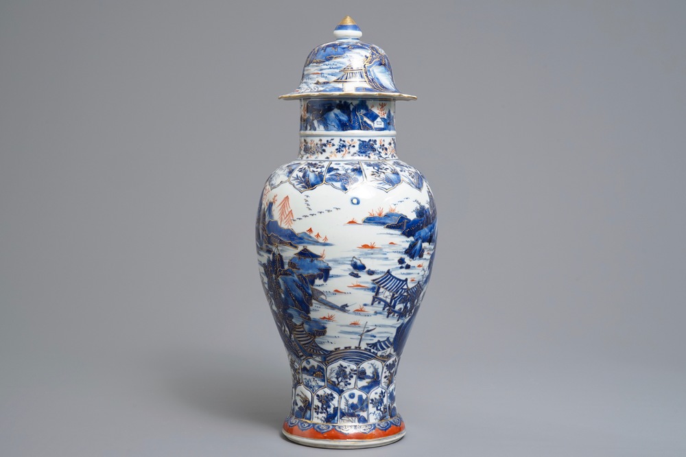 A Chinese clobbered blue and white vase and cover with landscape design, Kangxi