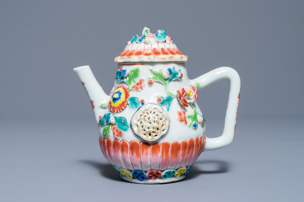 A Chinese famille rose teapot with applied floral design, Yongzheng
