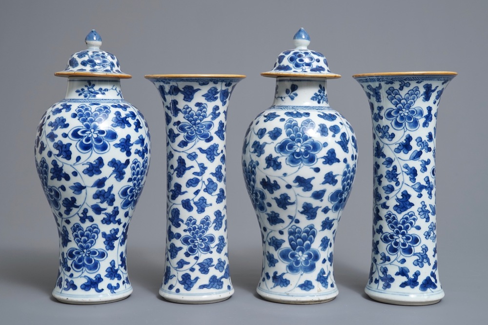 A Chinese blue and white four-piece garniture with floral design, Kangxi